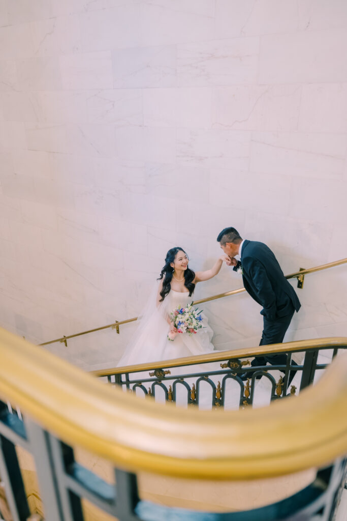 Anh and Tuan sharing a moment on a staircase