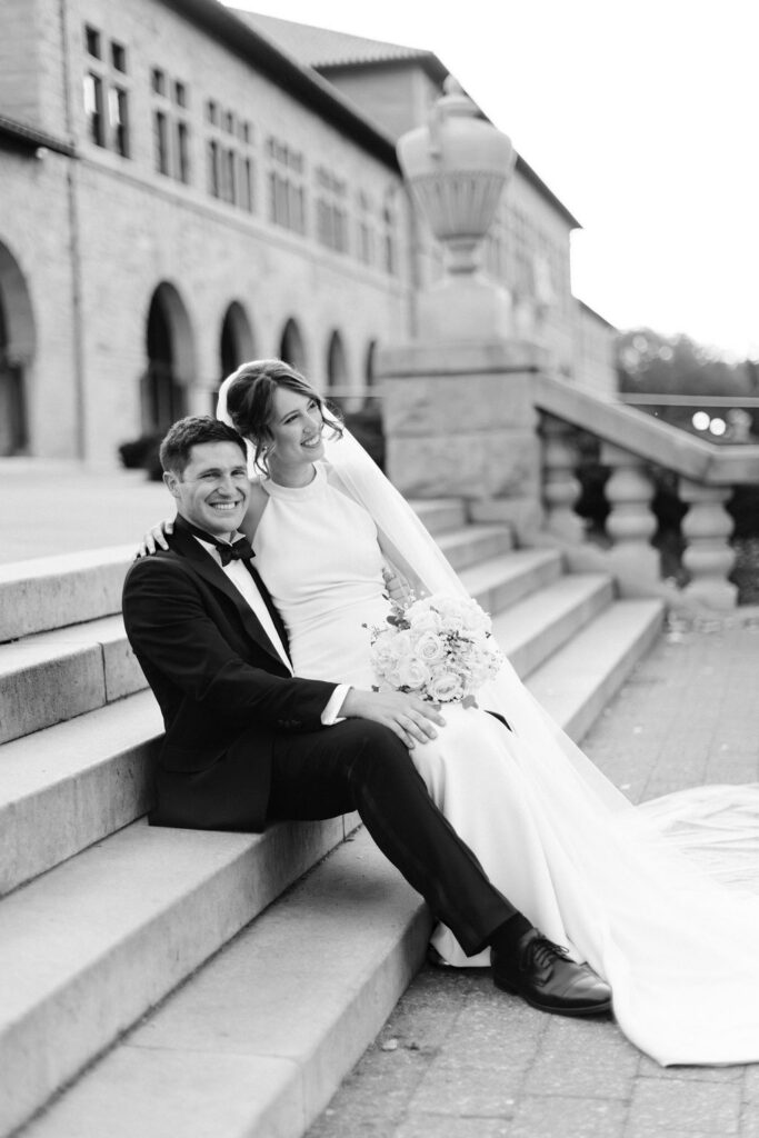 Makenna and Nicholaus sitting on Stanford campus steps