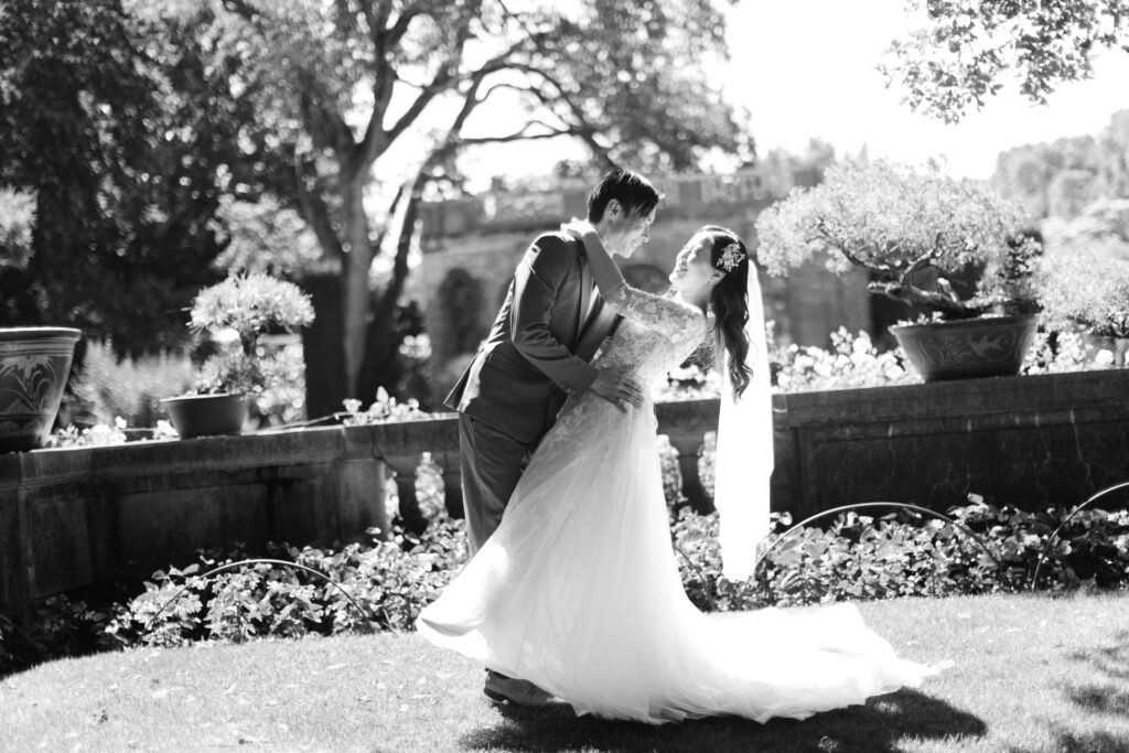 Monica and Kevin embracing in Filoli Gardens in black and white