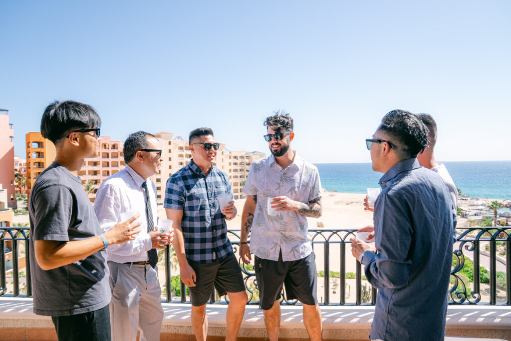 Chris and his groomsmen on celebrating on the balcony before the ceremony