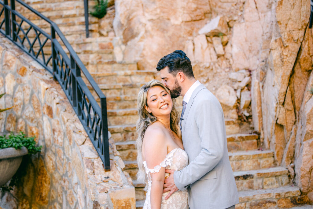 Chris kissing Jennifer as she smiles