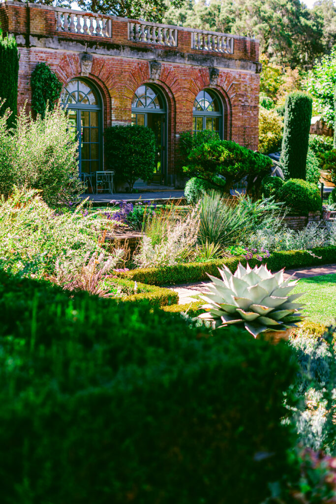 Filoli brick conservatory surrounded by formal gardens