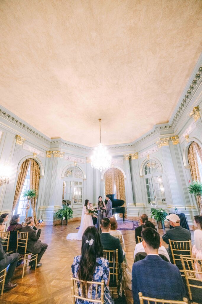 Wide view of Monica and Kevin’s intimate ceremony inside Filoli ballroom