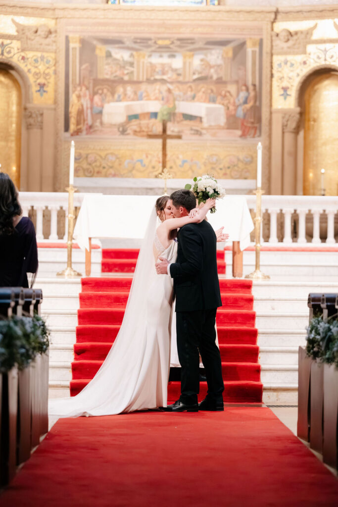 Nicholaus and Makenna’s kiss at the altar of Stanford Memorial Church