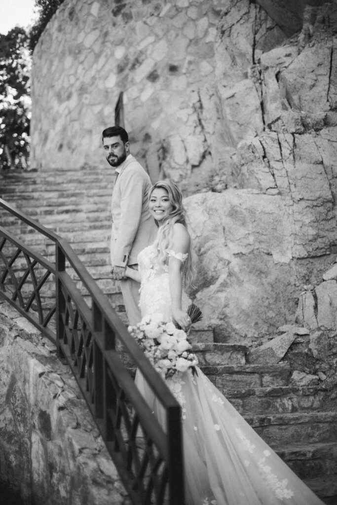 Black and white portrait of Chris and Jennifer on Sandos Finisterra stone steps
