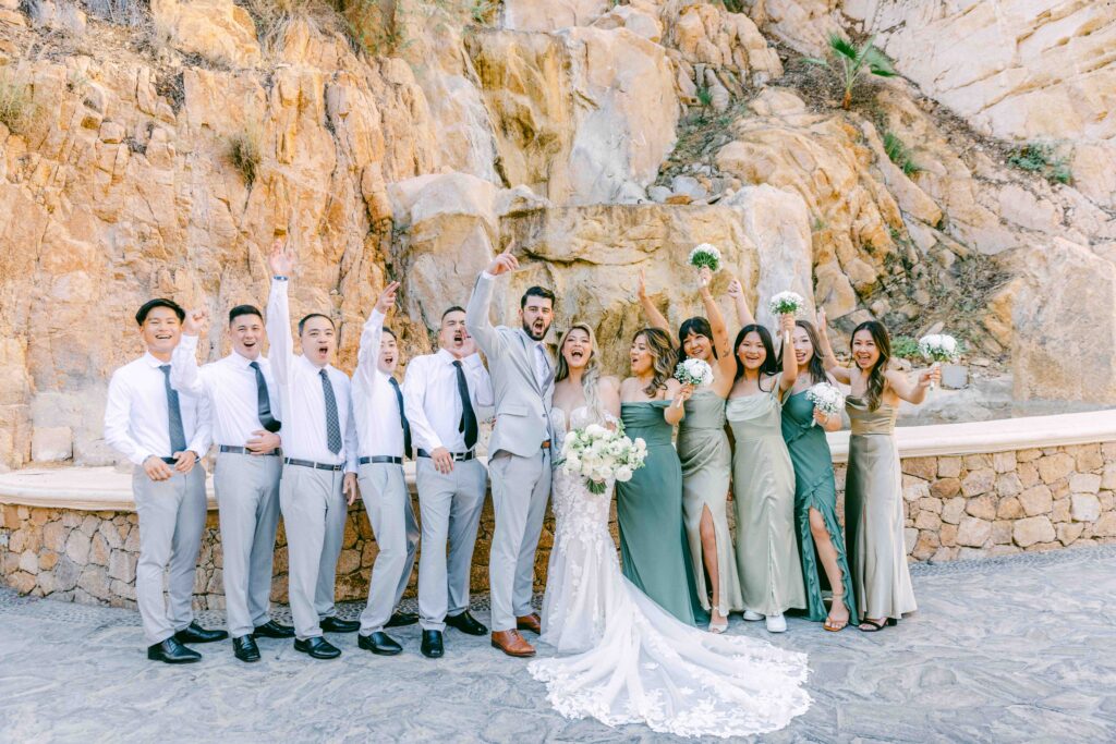 Chris, Jennifer, and their wedding party celebrating outside