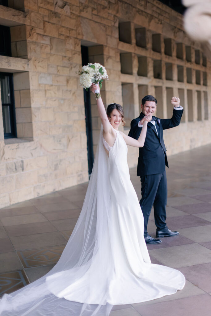 Makenna and Nicholaus celebrating outside Stanford Memorial Church