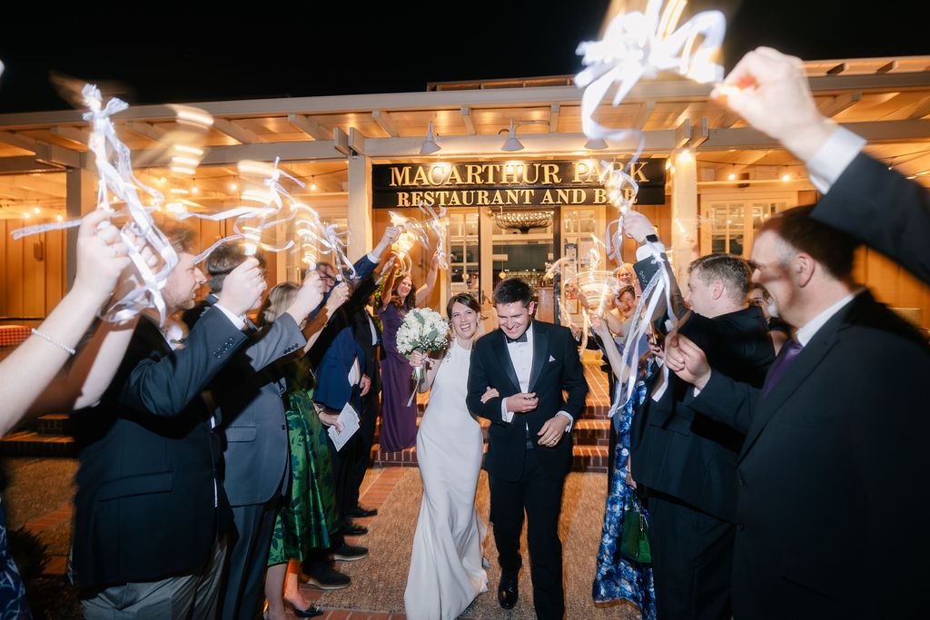 Makenna and Nicholaus exiting MacArthur Park Restaurant under sparklers