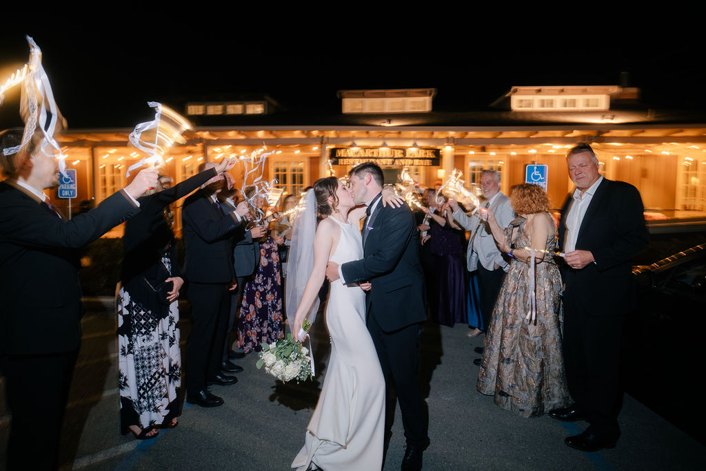 Makenna and Nicholaus kissing under sparklers outside MacArthur Park