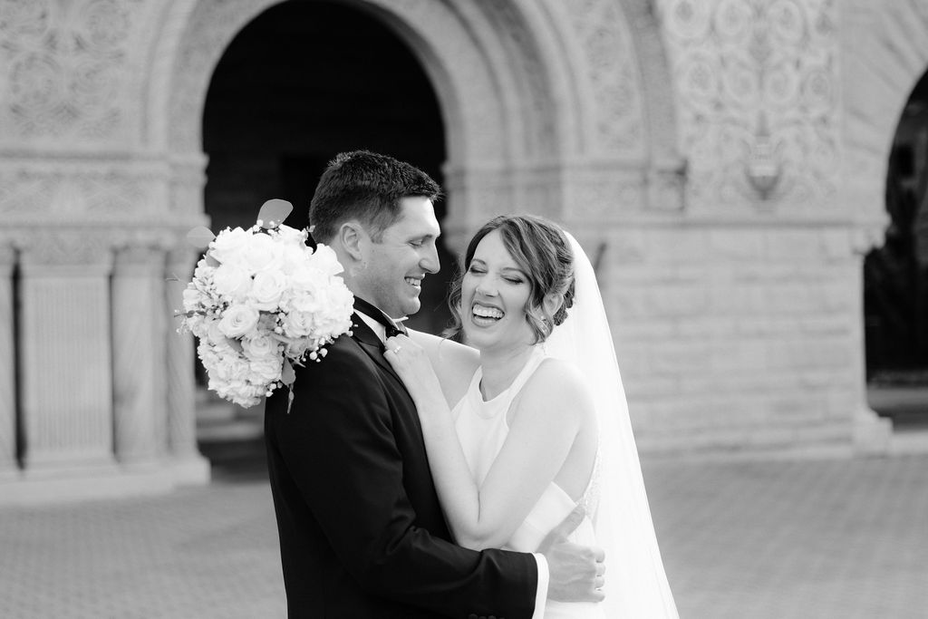 Makenna and Nicholaus laughing outside Stanford Memorial Church