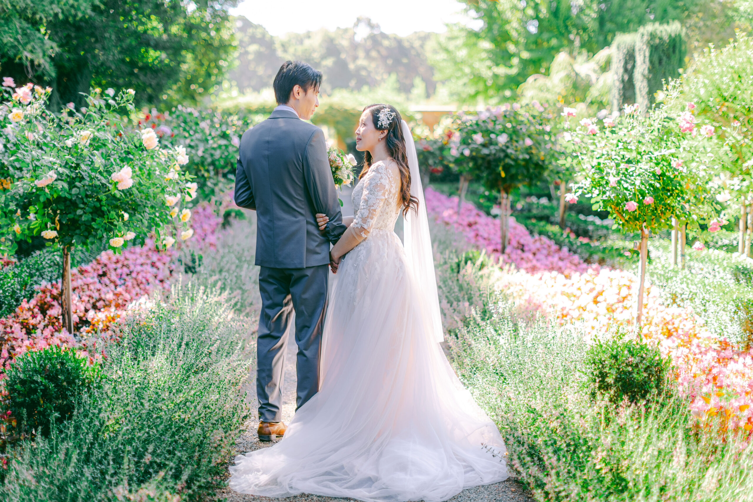 Monica and Kevin holding hands at their Filoli Gardens wedding