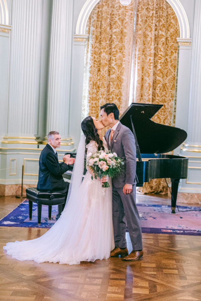 Monica and Kevin’s first kiss at the Filoli ballroom altar