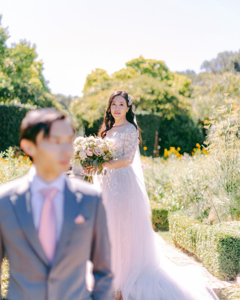 Monica looking back at Kevin in the Filoli rose garden
