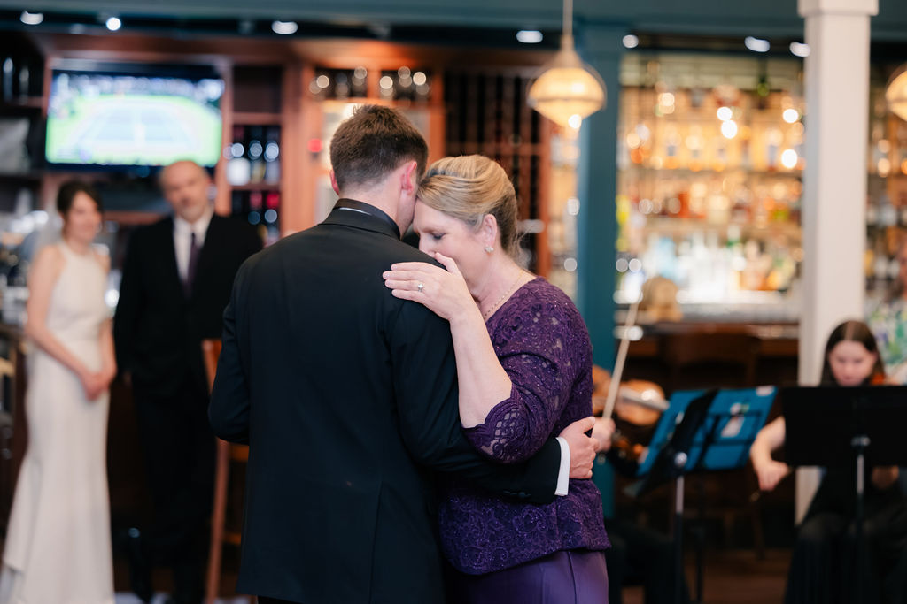 Nicholaus and his mother dancing at the reception