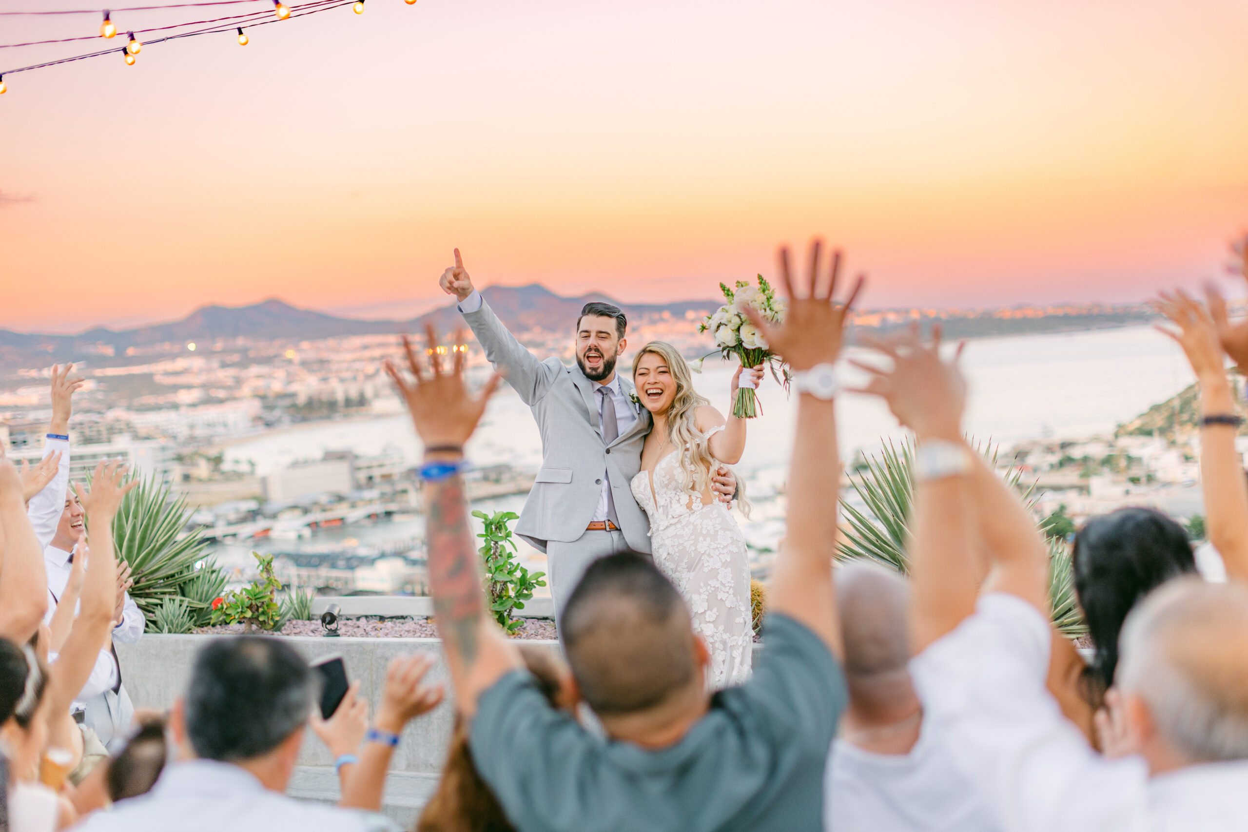 Jennifer and Chris celebrating at their Sandos Finisterra Los Cabos wedding