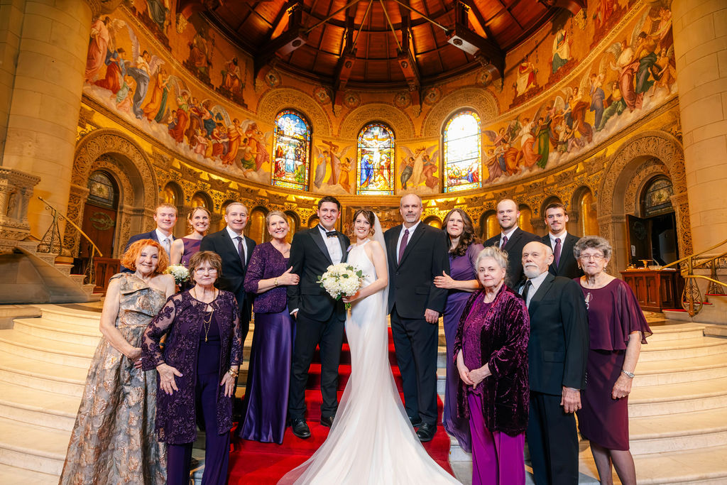 Makenna and Nicholaus with their loved ones at their Stanford Memorial Church wedding