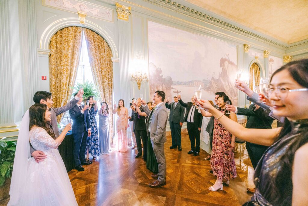 Guests toasting the newlyweds inside the Filoli ballroom