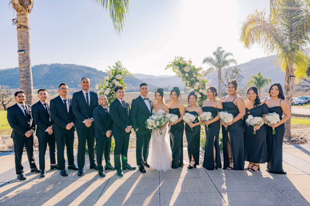 Cesar and Jocelyne outside with their bridesmaids and groomsmen